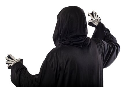 The grim reaper or death halloween costume isolated on a white background.  The skeleton is wearing a hooded black robe. Side view in profile for composites.の写真素材