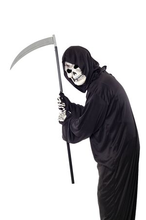 The grim reaper or death halloween costume isolated on a white background.  The skeleton is wearing a hooded black robe. Side view in profile for composites.の写真素材