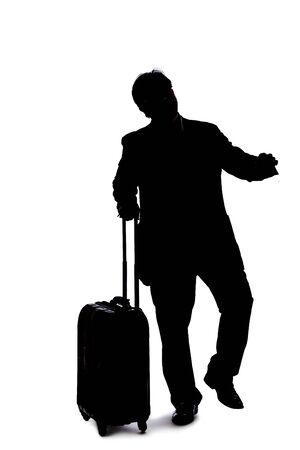 Silhouette of a backlit model posing as a businessman on a white background.  He is gesturing like he is happy or winningの写真素材