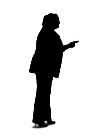 Silhouette of a curvy or plus size businesswoman on a white background for composites.  She is talking to someoneの写真素材