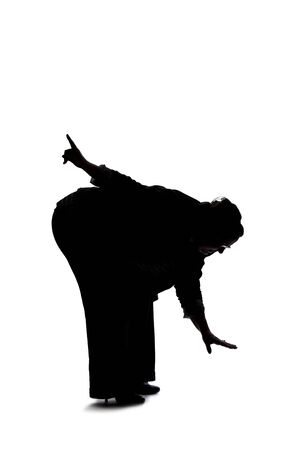 Silhouette of a curvy or plus size businesswoman on a white background for composites.  She is looking for something on the groundの写真素材