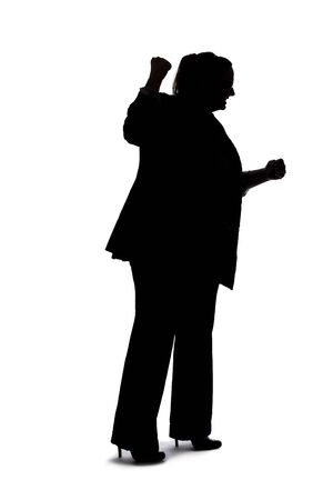 Silhouette of a curvy or plus size businesswoman on a white background for composites.  She is punching somethingの写真素材