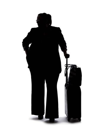 Silhouette of a curvy or plus size businesswoman on a white background for composites.  She is waiting patientlyの写真素材