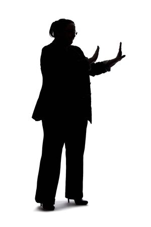 Silhouette of a curvy or plus size businesswoman on a white background for composites.  She is gesturing to stopの写真素材