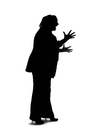 Silhouette of a curvy or plus size businesswoman on a white background for composites.  She is posed like she is angryの写真素材
