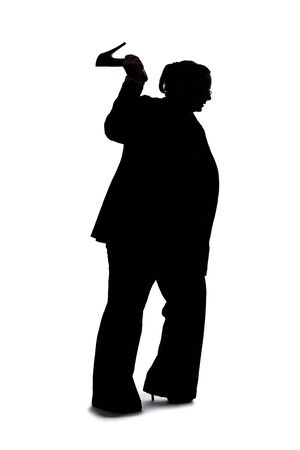 Silhouette of a curvy or plus size businesswoman on a white background for composites.  She is hitting something with heels of shoesの写真素材