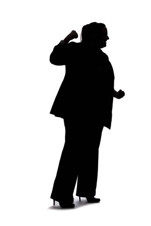Silhouette of a curvy or plus size businesswoman on a white background for composites.  She is punching somethingの写真素材