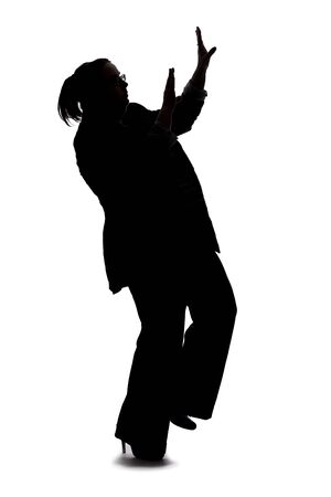 Silhouette of a curvy or plus size businesswoman on a white background for composites.  She is posed like she is falling or off balanceの写真素材