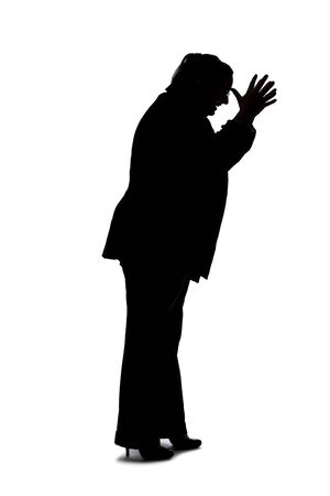 Silhouette of a curvy or plus size businesswoman on a white background for composites.  She is posed like she is angryの写真素材