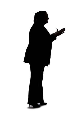 Silhouette of a curvy or plus size businesswoman on a white background for composites.  She is talking to someoneの写真素材