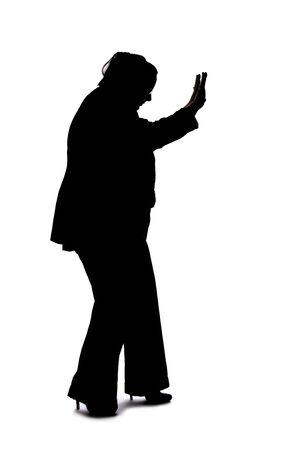 Silhouette of a curvy or plus size businesswoman on a white background for composites.  She is gesturing to stopの写真素材