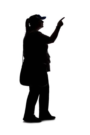 Silhouette of a curvy or plus size woman on a white background.  She is unrecognizable and is wearing casual apparel while pointing at somethingの写真素材