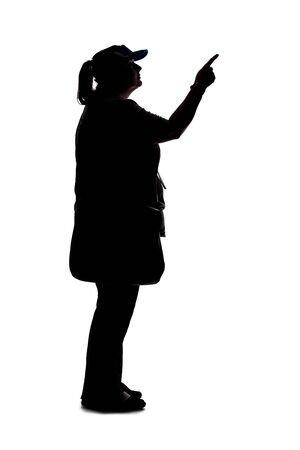 Silhouette of a curvy or plus size woman on a white background.  She is unrecognizable and is wearing casual apparel while pointing at somethingの写真素材