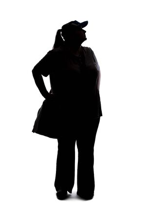 Silhouette of a curvy or plus size woman on a white background.  She is unrecognizable and standing or waitingの写真素材