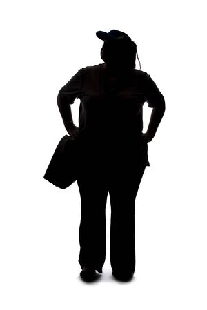 Silhouette of a curvy or plus size woman on a white background.  She is unrecognizable and standing or waitingの写真素材