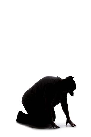 Silhouette of a curvy or plus size woman on a white background.  She is kneeling down and searching for something on the groundの写真素材