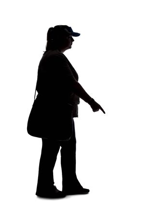 Silhouette of a curvy or plus size woman on a white background.  She is unrecognizable and is wearing casual apparel while pointing at somethingの写真素材