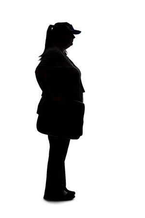 Silhouette of a curvy or plus size woman on a white background.  She is unrecognizable and is wearing casual apparel and waiting in lineの写真素材