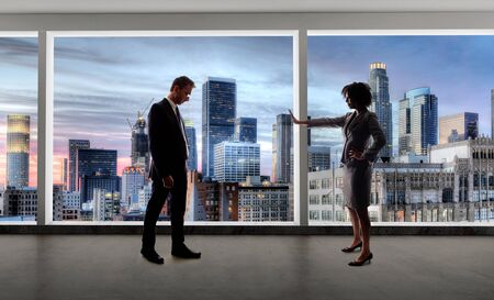 Business co workers or team having a meeting while keeping 6 feet social distancing for coronavirus or pandemic prevention.  Depicts the new normal of work while keeping the economy goingの写真素材