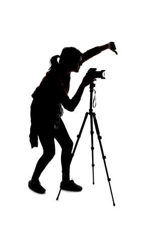 Silhouette of a photographer with a camera on a white background isolated for composites. She is posed with a thumbs down gestureの写真素材