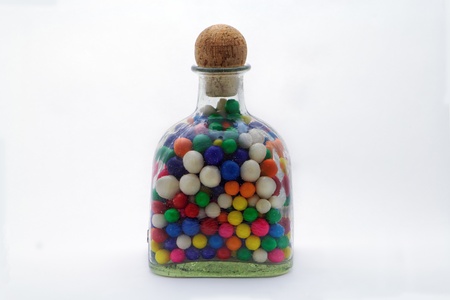 The gumballs held in the glass bottle  waiting to be released be some young child that has just completed his chores.  This should be the reward for all good children who their chores.の写真素材