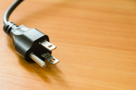 Plug on the table background