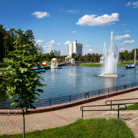 Relaxation, recreation. Resting place, a park with a pond, fountains, boatの写真素材