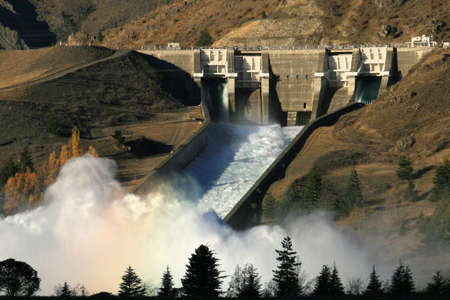 Relieving flood waters from behind the damの写真素材