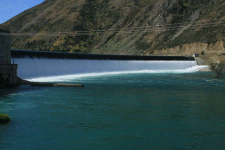 Relieving flood waters from behind the damの写真素材