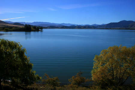 Autumn mountain vista across Lake Benmore, Waitaki valley, New Zealandの写真素材