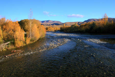 Autumn mountain vista down the Otematata River, Waitaki valley, New Zealandの写真素材
