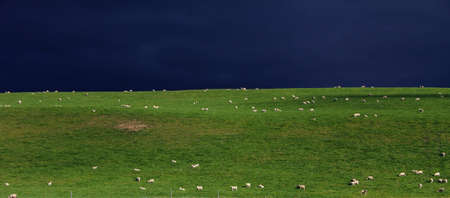 Storm Clouds over fieldsの写真素材