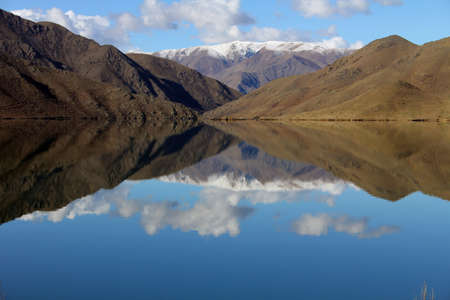 Mountain vista across Lake Benmore, Waitakki valley, New Zealandの写真素材