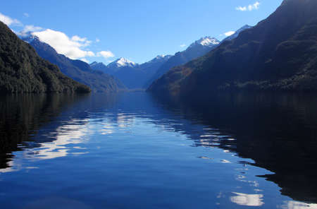 Across lake to mountainsの写真素材