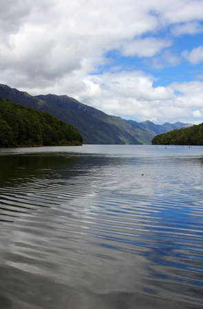 Across lake to mountainsの写真素材