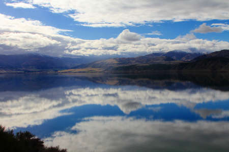 Across lake to mountainsの写真素材