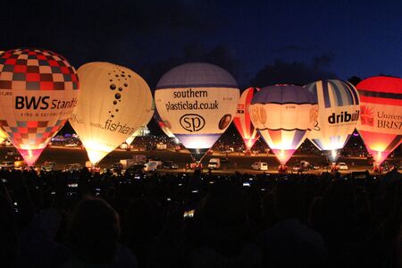 BRISTOL, ENGLAND - AUGUST 9, 2018 - Nightglow, International Balloon Festival.  Annual hot air balloon festival nightglow where the tethered balloons' firing is choreographed to music.のeditorial素材