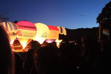 BRISTOL, ENGLAND - AUGUST 9, 2018 - Nightglow, International Balloon Festival.  Annual hot air balloon festival nightglow where the tethered balloons' firing is choreographed to music.のeditorial素材