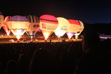 BRISTOL, ENGLAND - AUGUST 9, 2018 - Nightglow, International Balloon Festival.  Annual hot air balloon festival nightglow where the tethered balloons' firing is choreographed to music.のeditorial素材