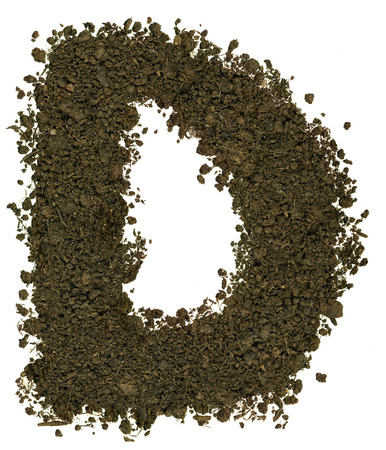 Alphabet made of brown soil on white background. High sharp and detail. Letter Bの写真素材