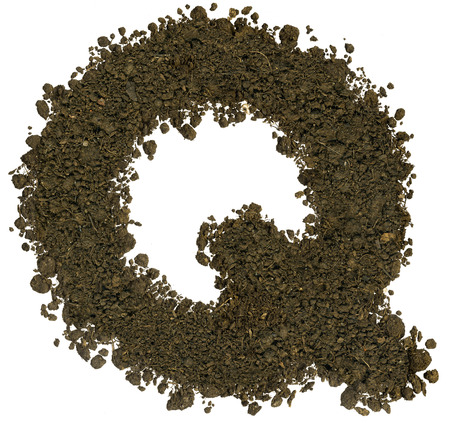 Alphabet made of brown soil on white background. High sharp and detail. Letter Qの写真素材