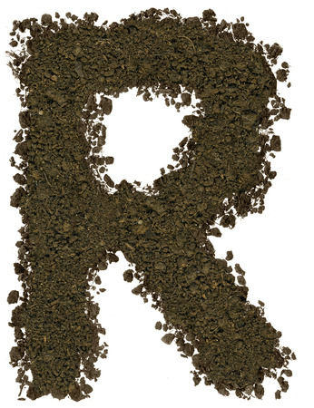 Alphabet made of brown soil on white background. High sharp and detail. Letter Rの写真素材
