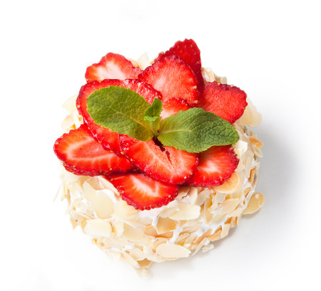 Strawberry cheesecake with almonds and fresh berries isolated on white background.の写真素材