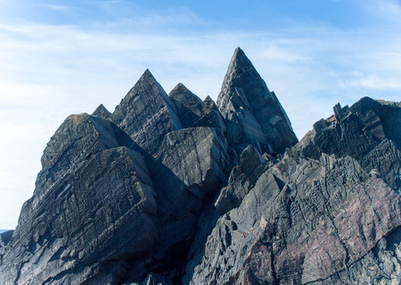 Grey Arctic rocks on the background of the northern skyの写真素材