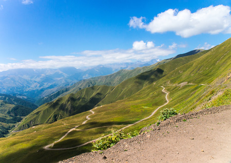 The road through the mountain pass in Georgiaの写真素材