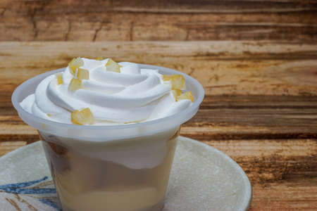 Custard dessert placed on an old table