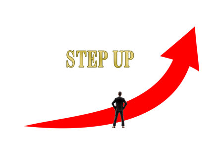 Businessman standing in front of a red graph with text - Step upの写真素材