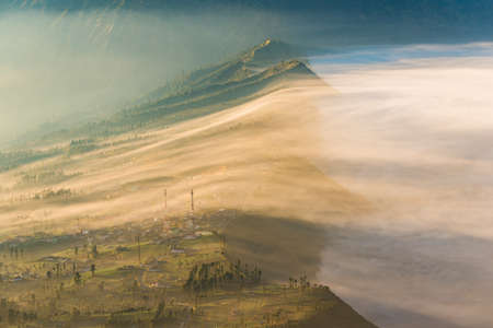Cemoro Lawang; small village in morning mist. Which situated on the edge of massive north-east of Mount Bromo, East Java, Indonesiaの写真素材