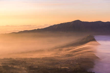 Cemoro Lawang; small village in morning mist. Which situated on the edge of massive north-east of Mount Bromo, East Java, Indonesiaの写真素材