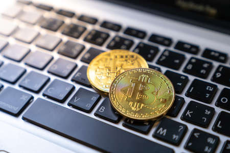 golden bitcoin on keyboard, Digital Currenyの写真素材